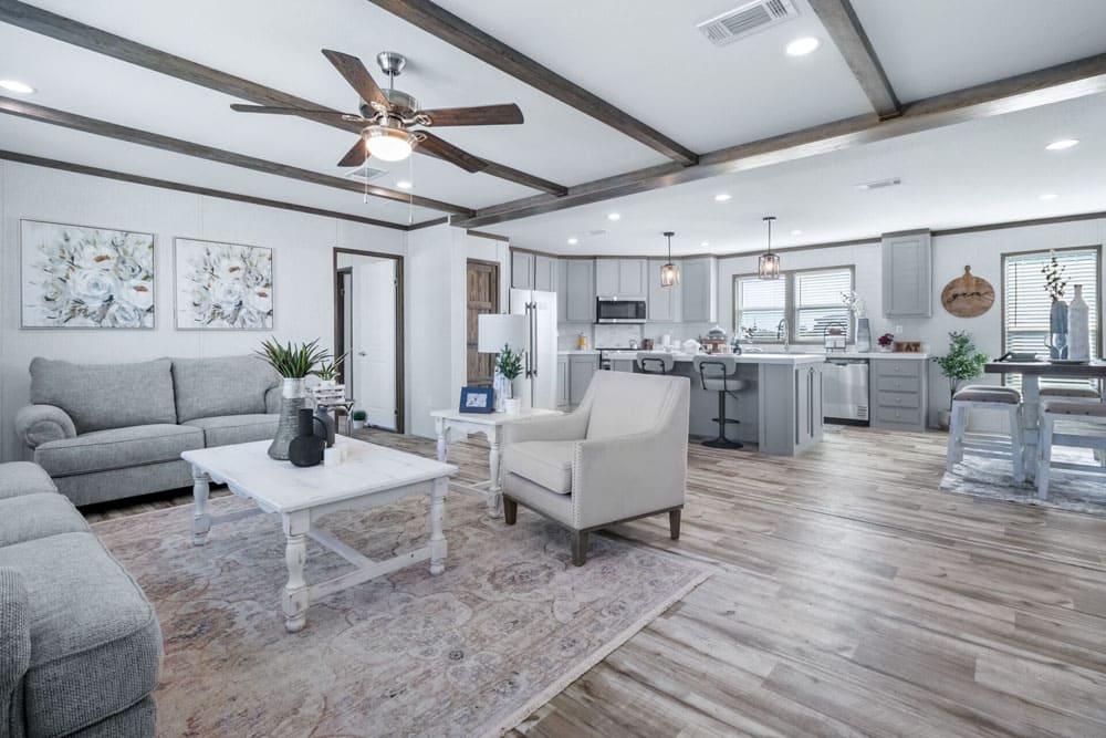 Open-concept living room and kitchen in The Murphy double-wide home