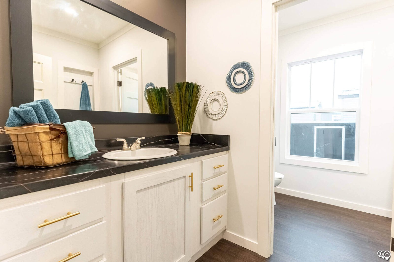 Guest bathroom vanity with storage cabinets in The Trinity CS-3242