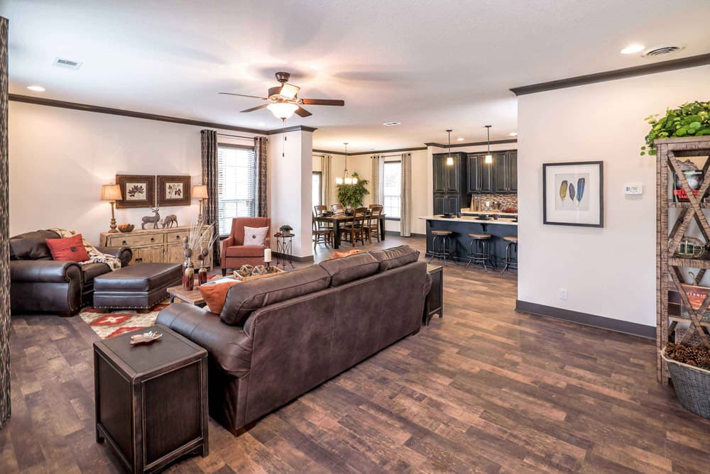 Open living room, dining area and kitchen in The Nandina doublewide