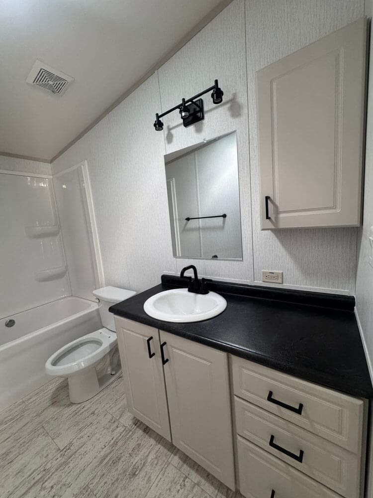 Guest bath vanity and tub-shower in The Lucia S-2856-32FLP doublewide