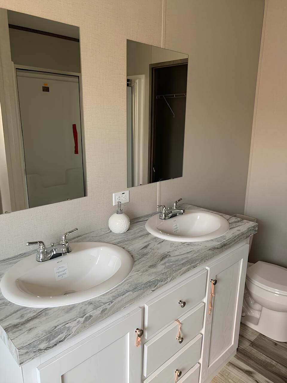 Double-sink bathroom vanity in The Cuatro by Jessup Housing