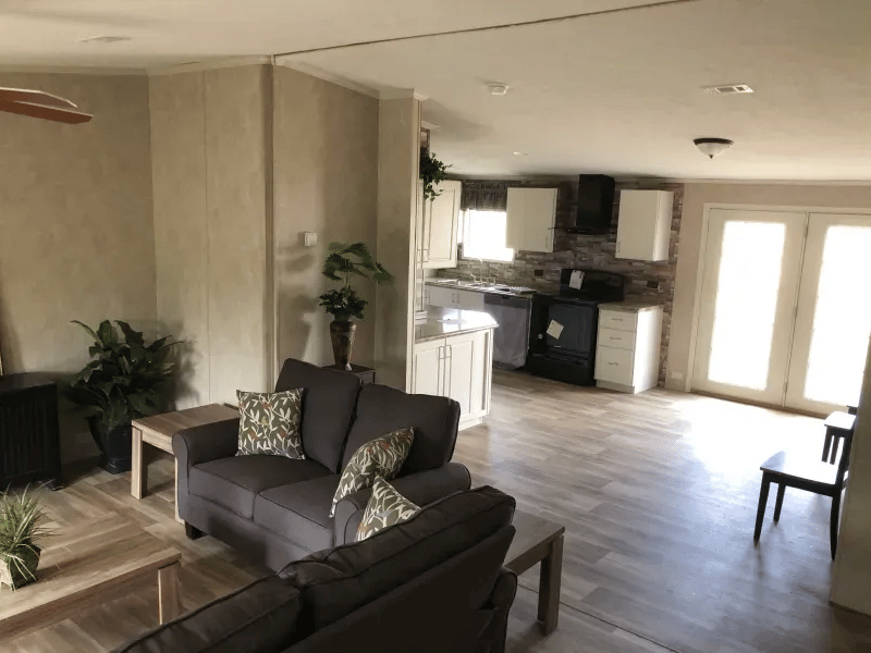Furnished living room in the Legacy 32x48 manufactured home near Tyler TX