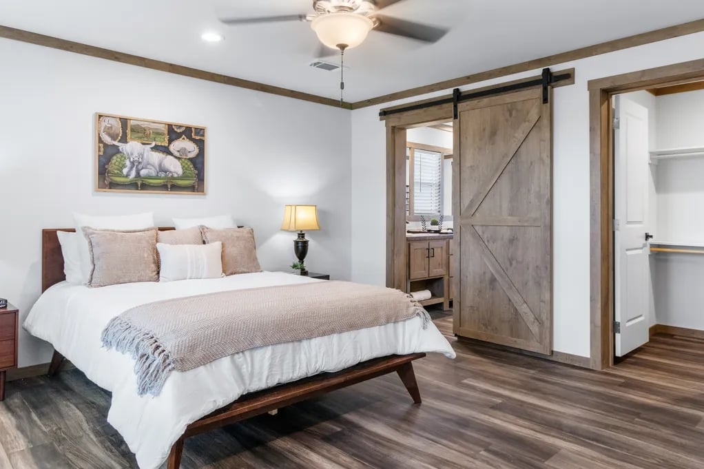 Isabella Elite primary suite with barn door access to the bathroom and walk-in closet
