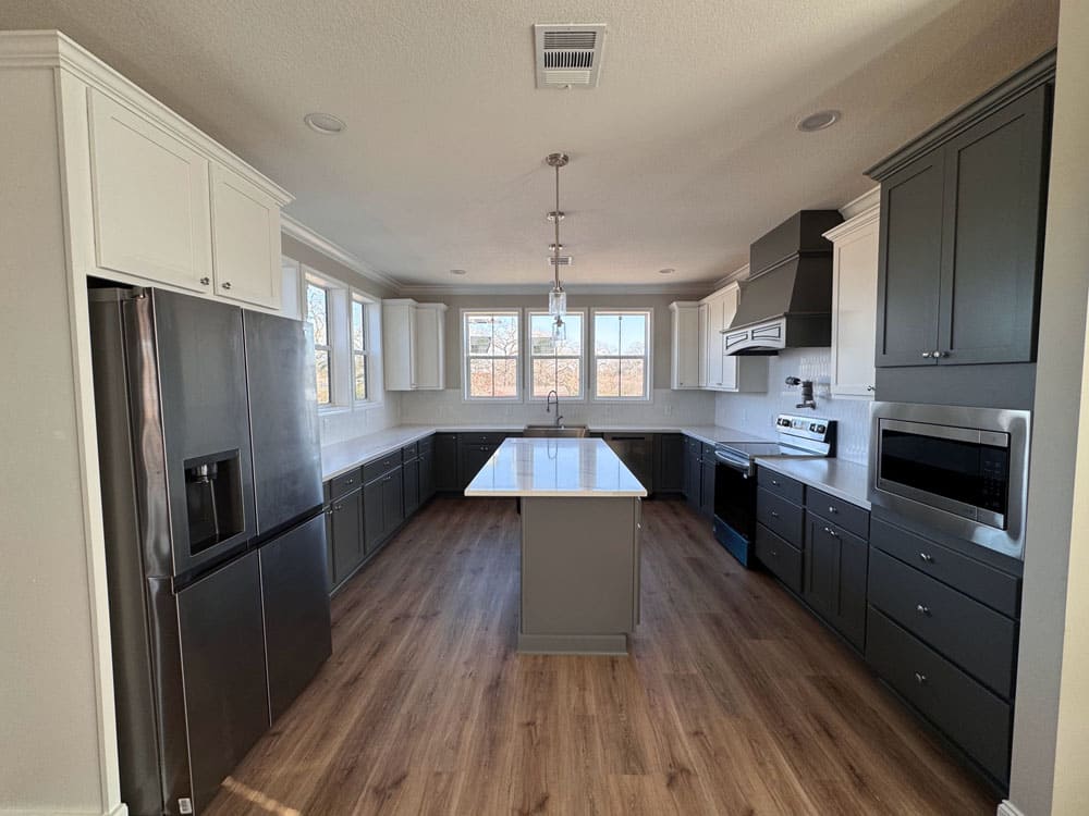 Two-tone kitchen with center island in The Lilly II modular home