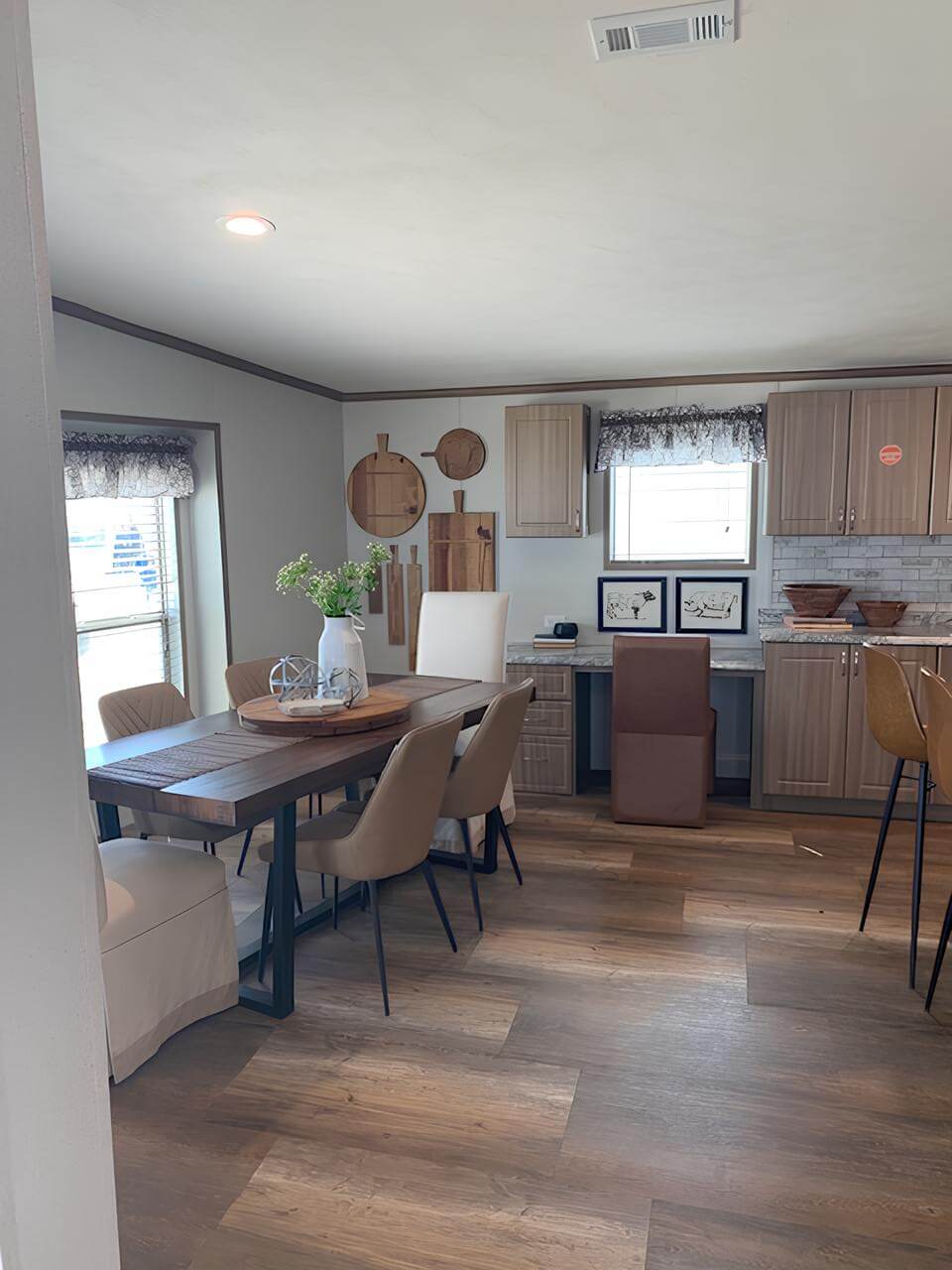 Dining area and built-in desk in The Lakehouse by Legacy Housing