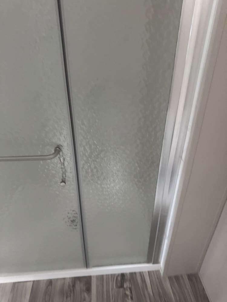 Private walk-in shower in brand new Legacy Housing 5 bed 5 bath oilfield workforce housing unit