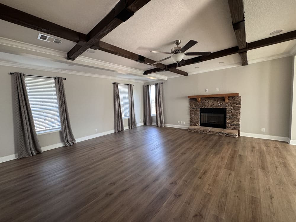 Bright living room with fireplace in The Lilly II by Franklin Homes