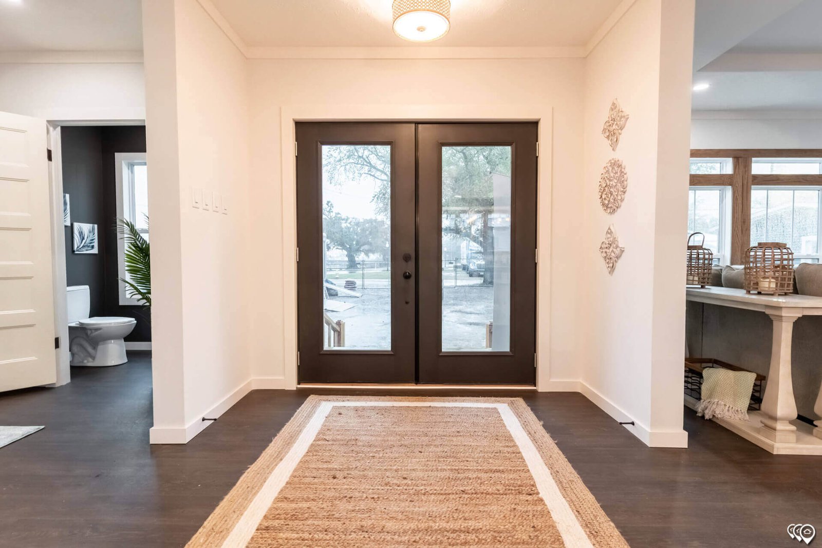 Welcoming foyer with double entry doors in The Trinity CS-3242 home