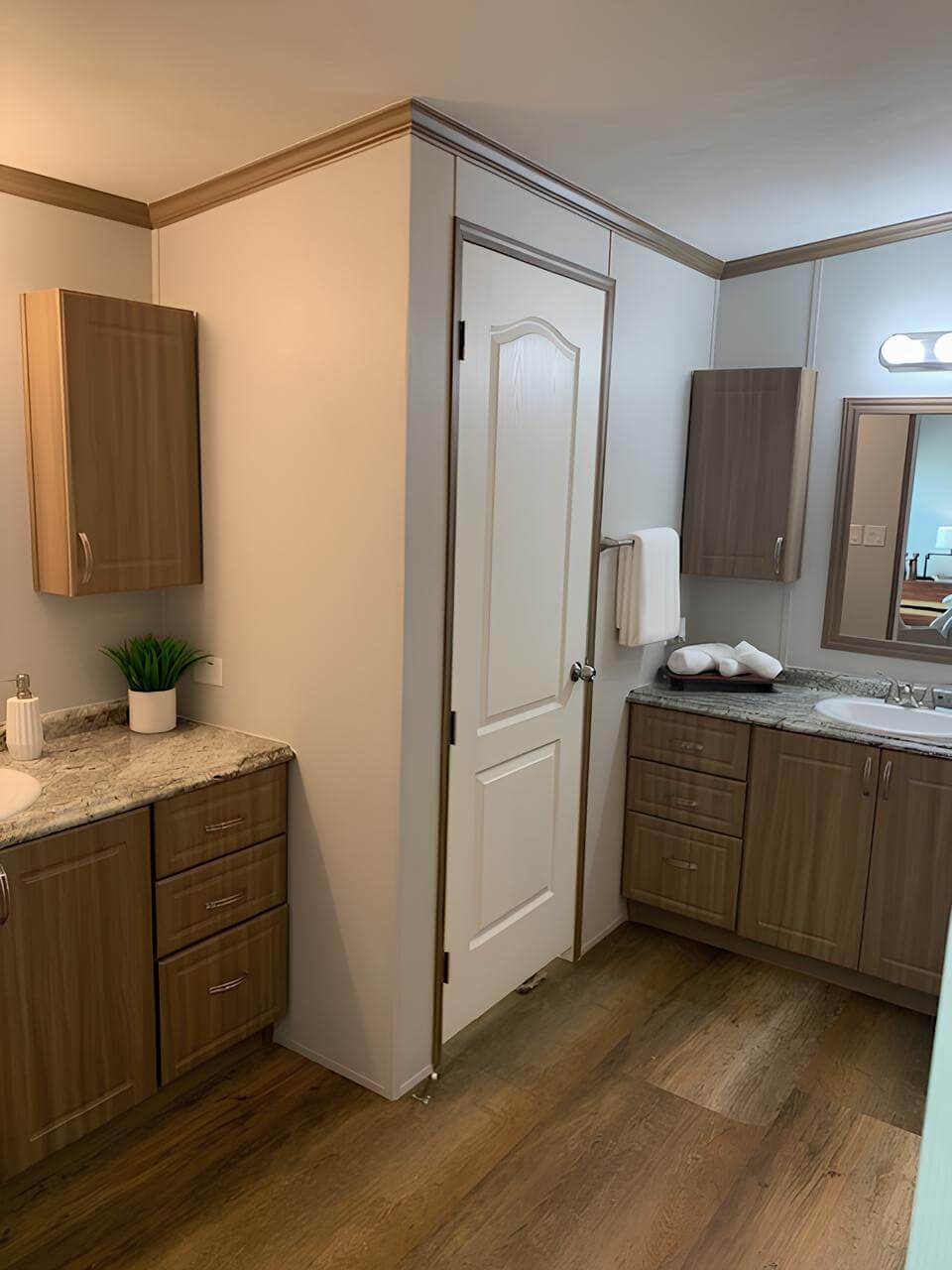 Primary bathroom with dual vanities in The Lakehouse manufactured home