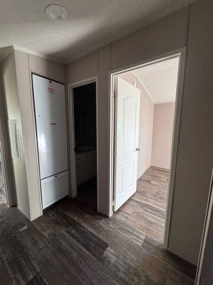 Interior hallway leading to a bedroom in The Leyla singlewide manufactured home