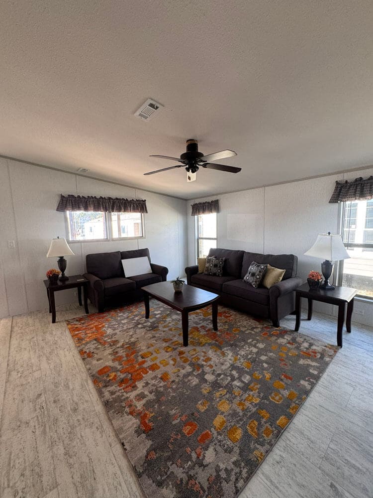 Bright furnished living area in The Lucia mobile home