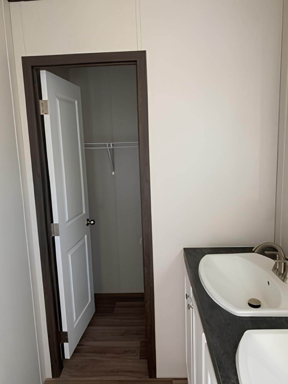 Double vanity and closet access in The Spirit primary bathroom