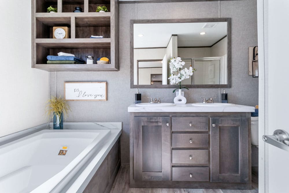 Double-sink vanity and deck tub in The Wilson manufactured home by Jessup Housing