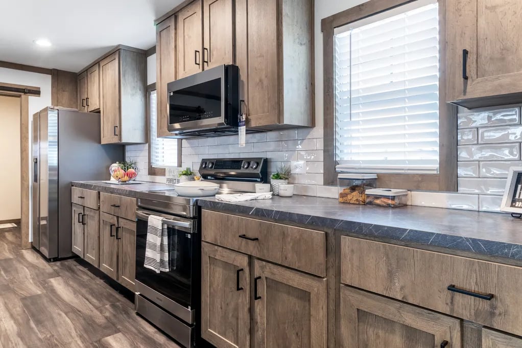 Spacious kitchen counters and wood cabinetry in the Clayton NXT Isabella Elite
