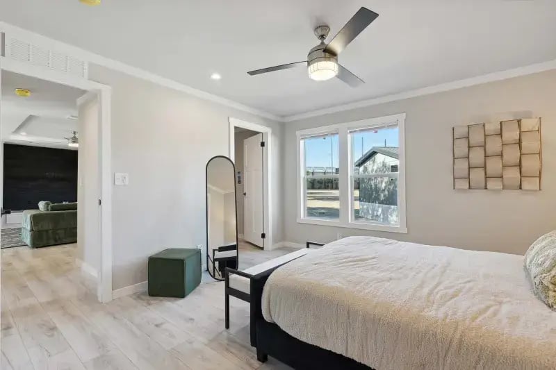 Primary bedroom with ensuite entrance in The Carol home by Champion Homes