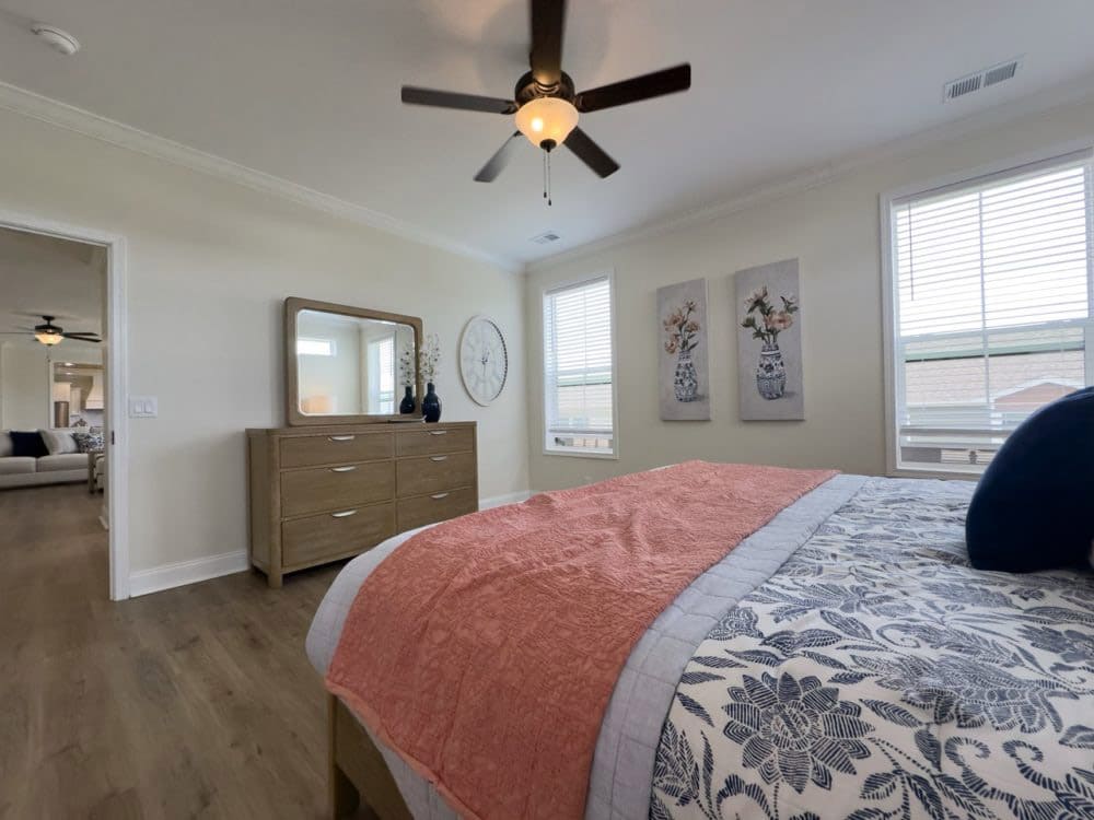 Spacious primary suite in The Riverwalk manufactured home