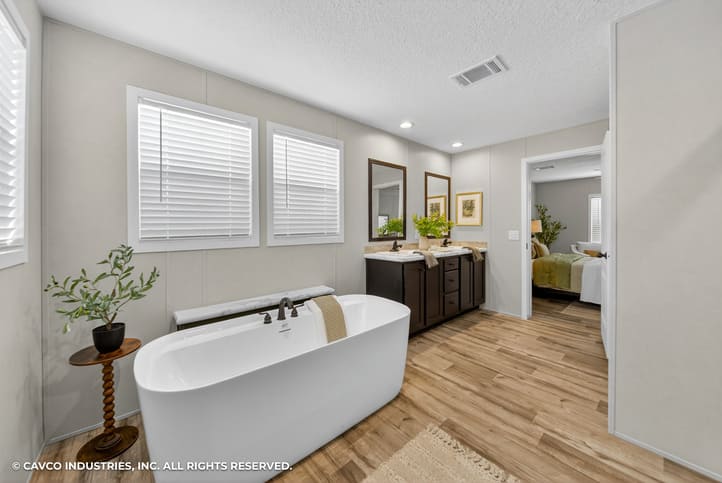 Freestanding tub and dual-sink vanity in The Vantage manufactured home