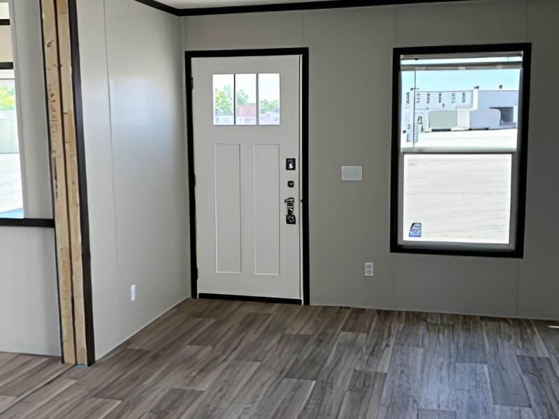 Bright living room entry in The Blitz 24x66 manufactured home in Bonham, TX
