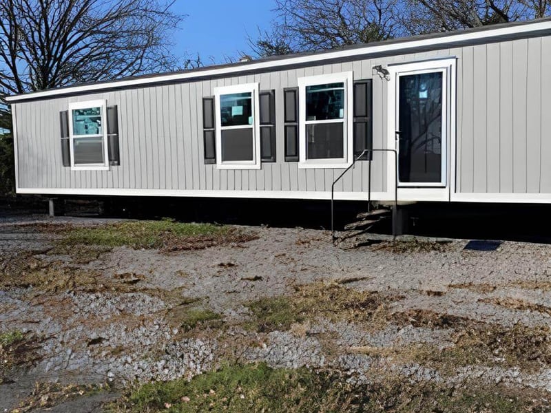 Gray exterior of The Spirit 16x56 manufactured home for sale in Bonham, TX
