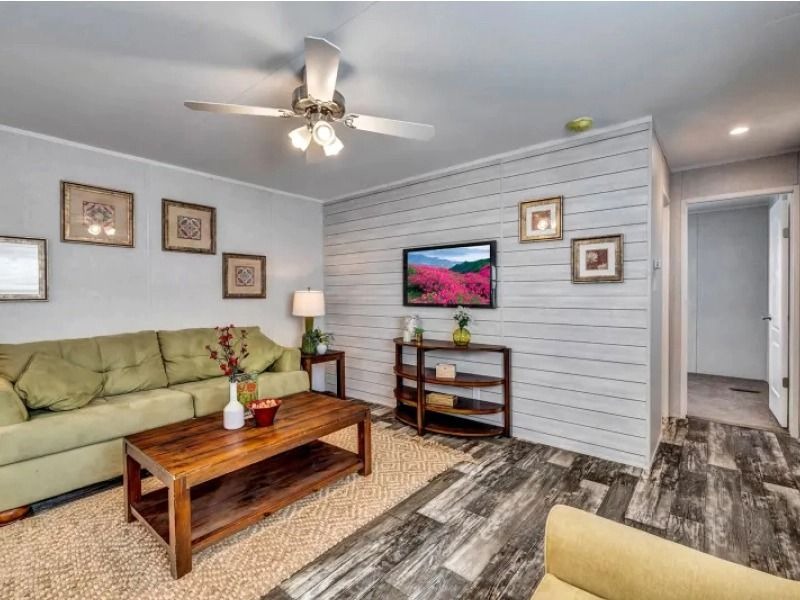 Furnished living room in the Redman 1656-A mobile home near Tyler TX