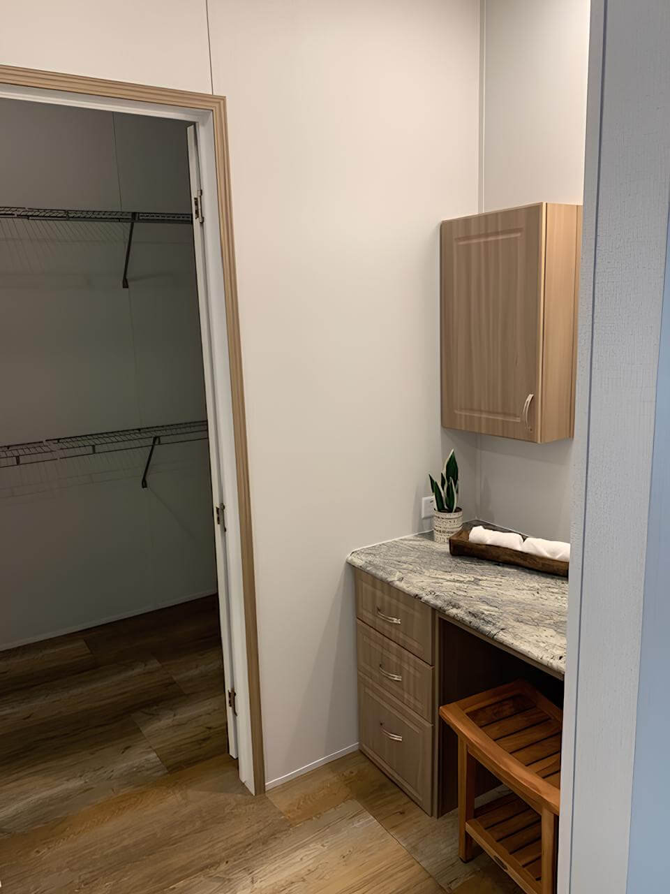 Built-in vanity beside the walk-in closet in The Lakehouse in Bonham, TX