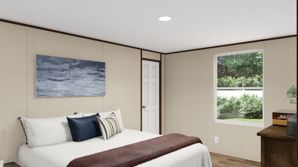 Guest bedroom with large window and closet in The Thrill by TRU Homes