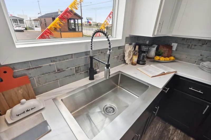 Stainless steel sink inside the Winter Series 3276H double-wide home