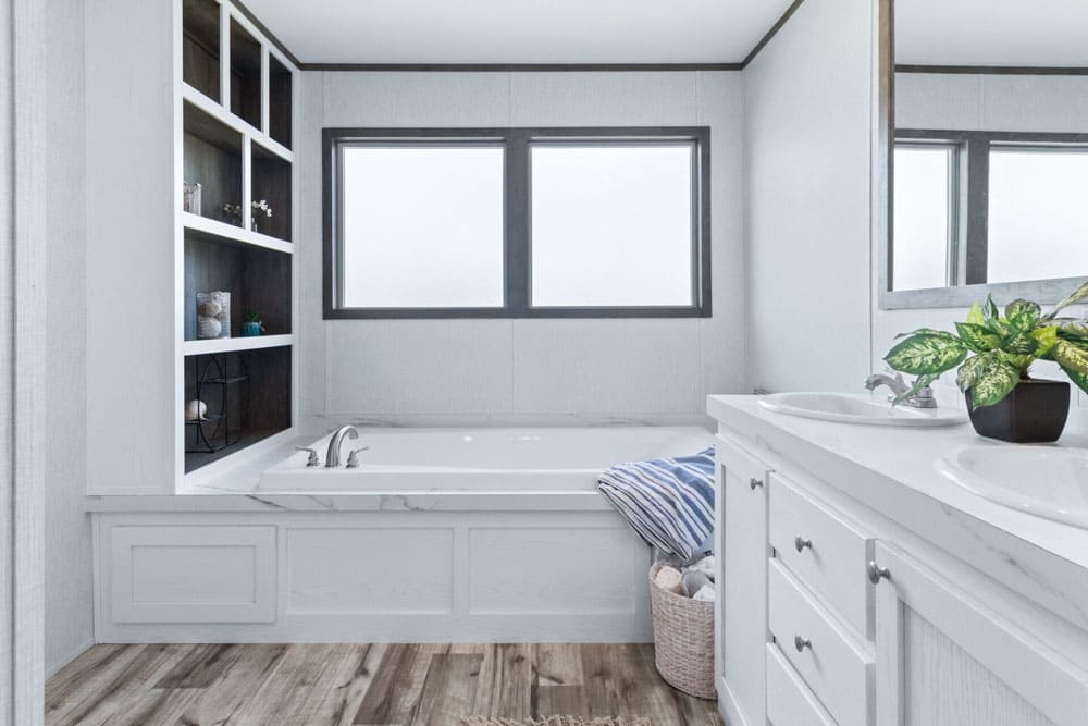 Soaking tub with built-in shelving in this 2,040-square-foot double-wide