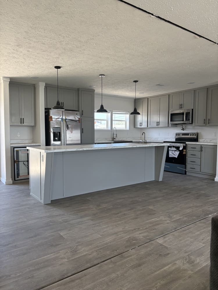 Modern kitchen and dining area in new 2025 Big Josh 32x80 doublewide
