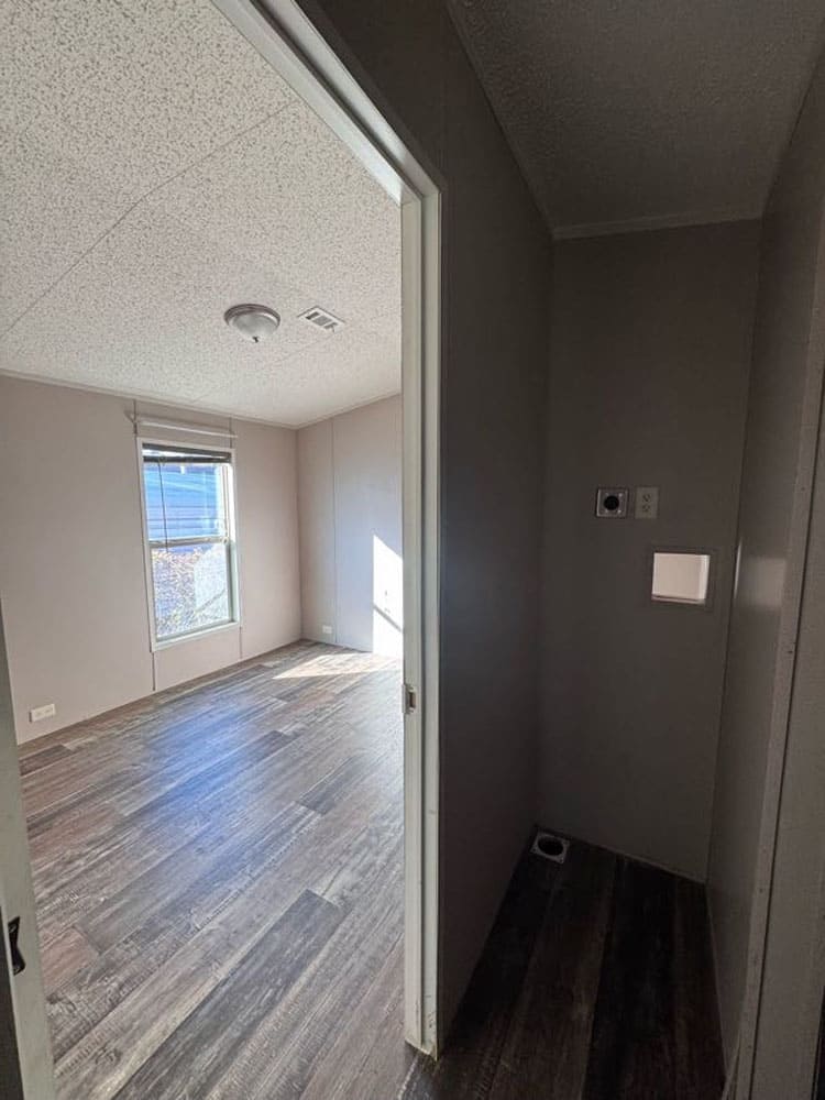 Laundry hookup nook beside the second bedroom in The Leyla by Legacy Housing