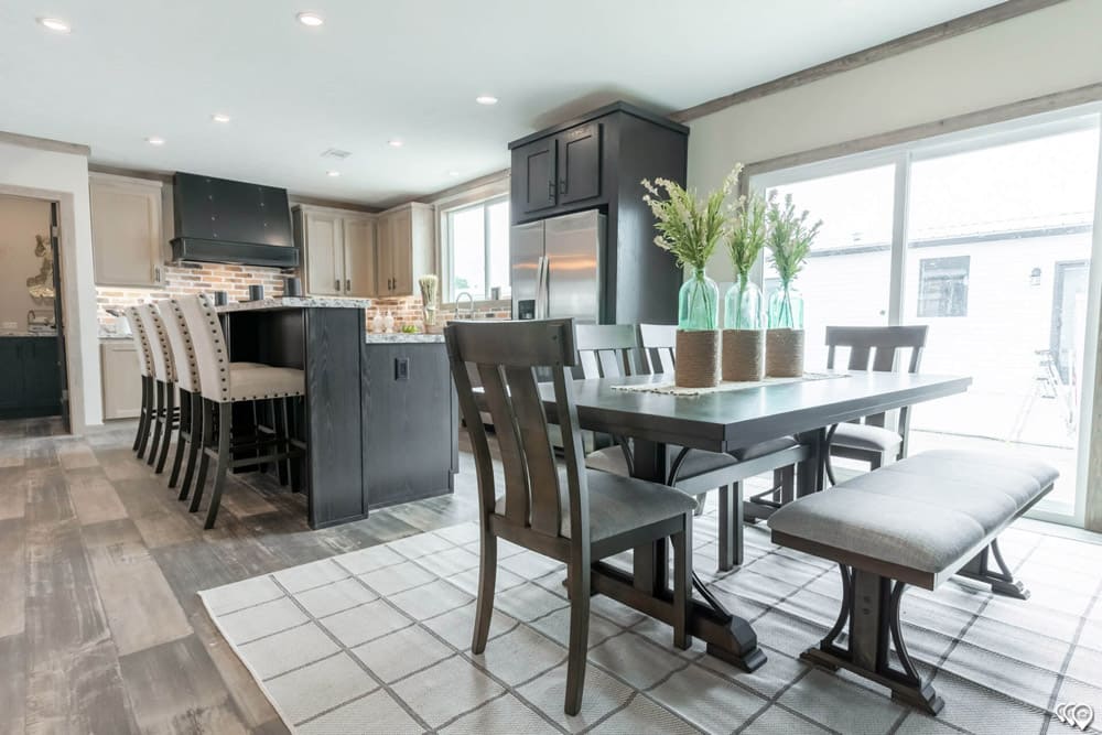 Dining room beside the island kitchen in The Shoal Creek