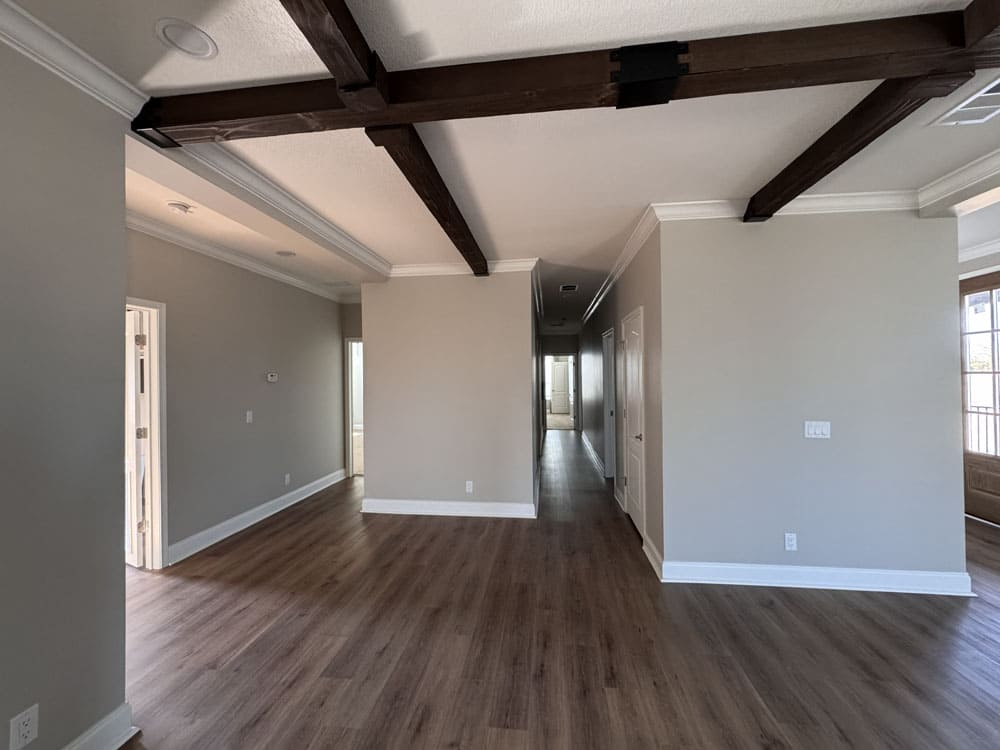 Open floor plan and hallway inside The Lilly II by Franklin Homes