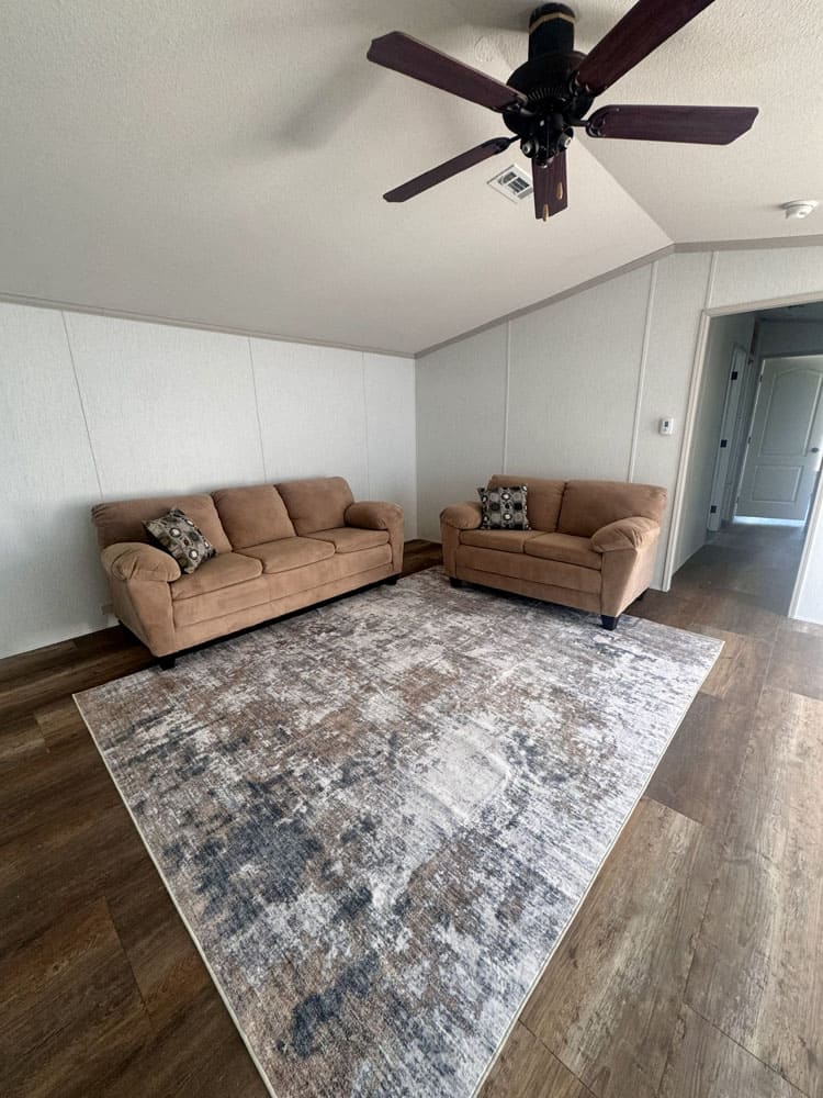 Comfortable living area in the Legacy Housing H-1880-32E