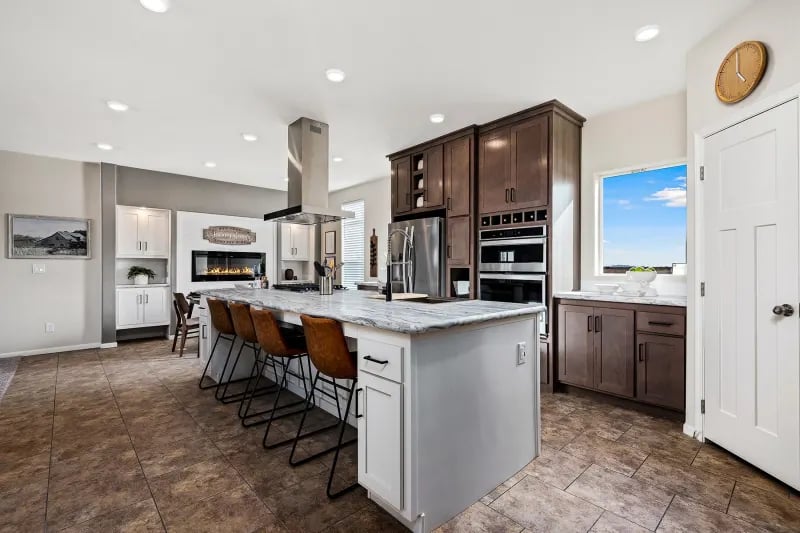 Modern kitchen with island in The Odyssey XL 3256 double-wide