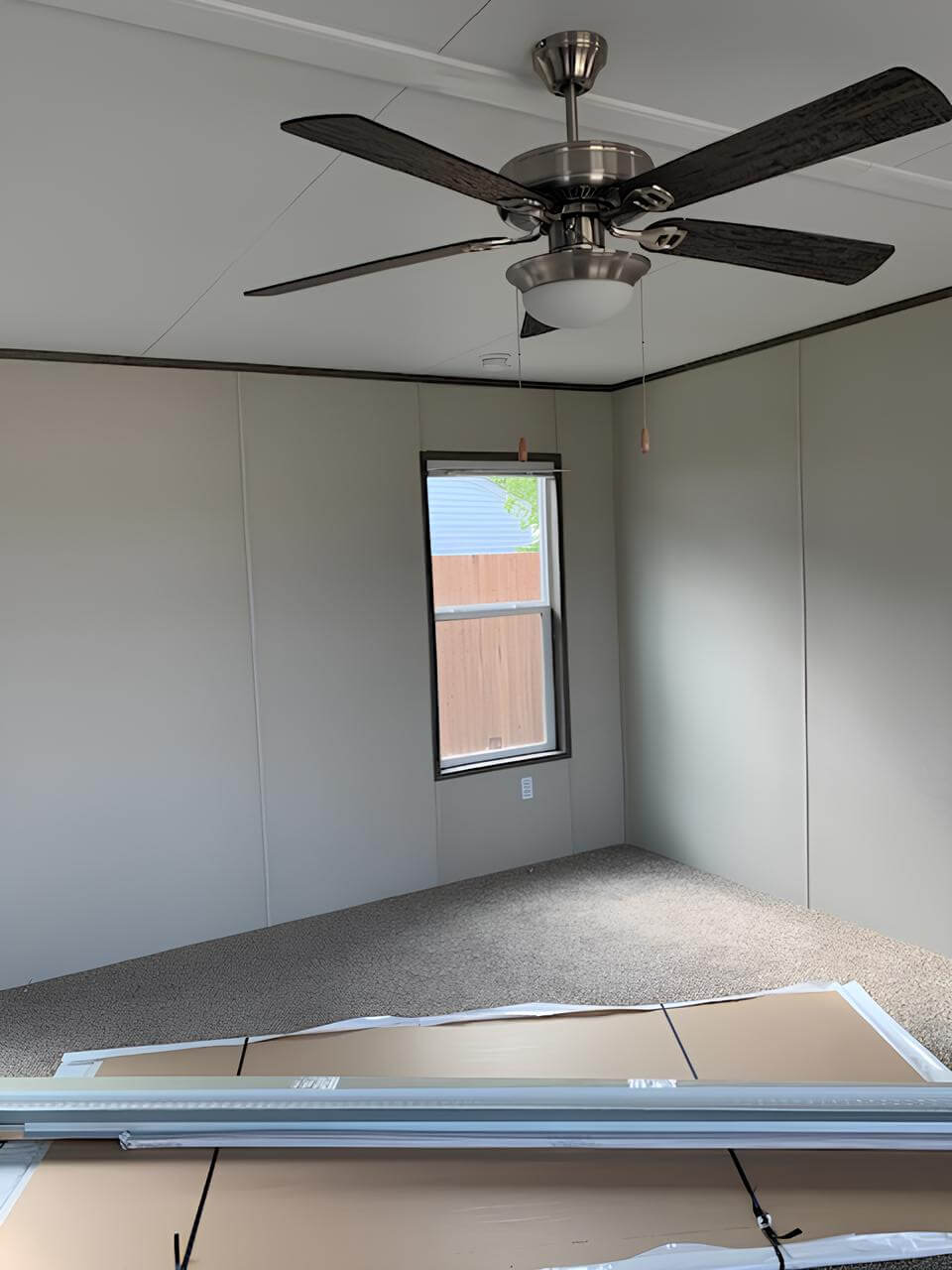 Bright secondary bedroom with ceiling fan in The Cuatro