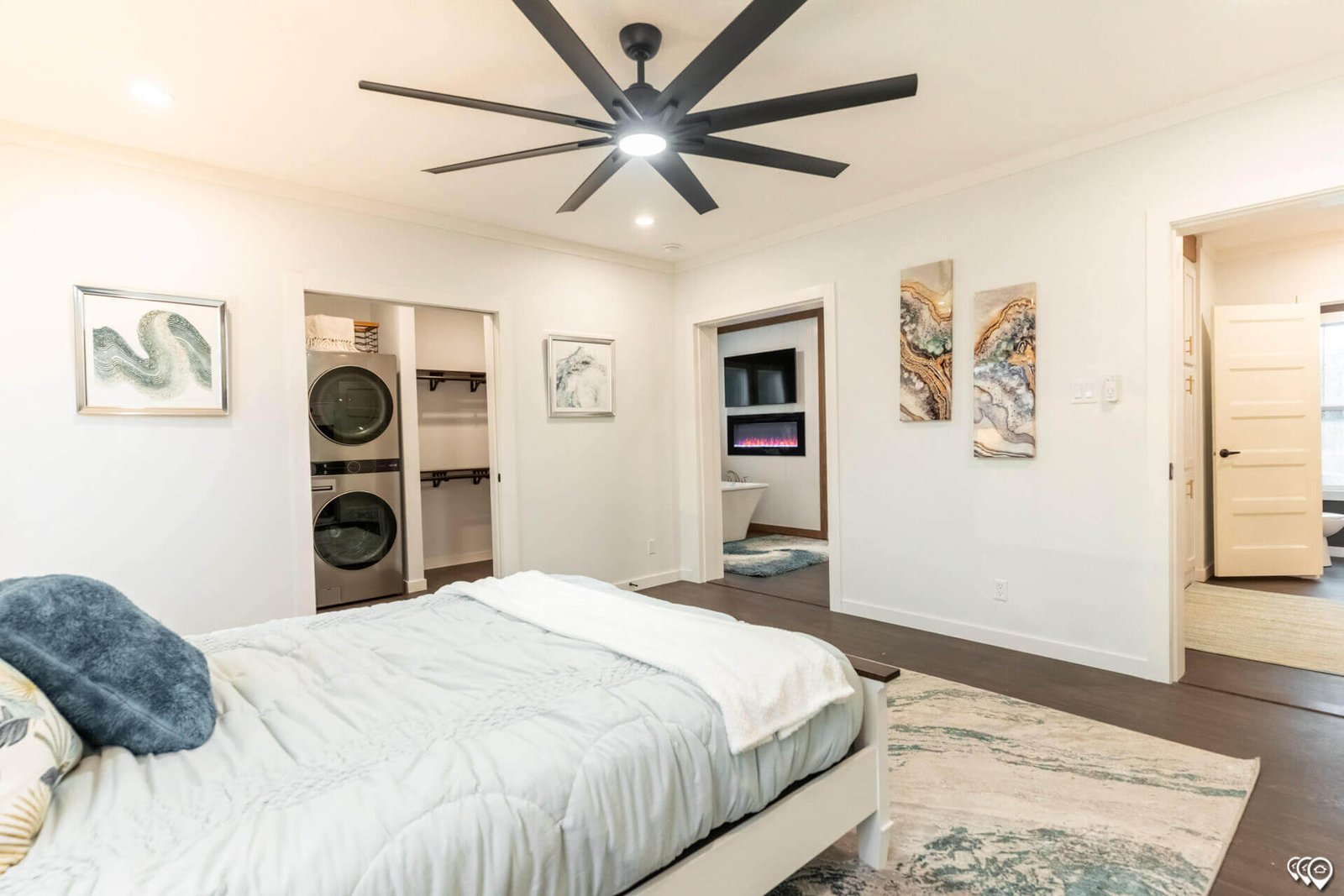Primary bedroom with closet, laundry, and bathroom access in The Trinity CS-3242