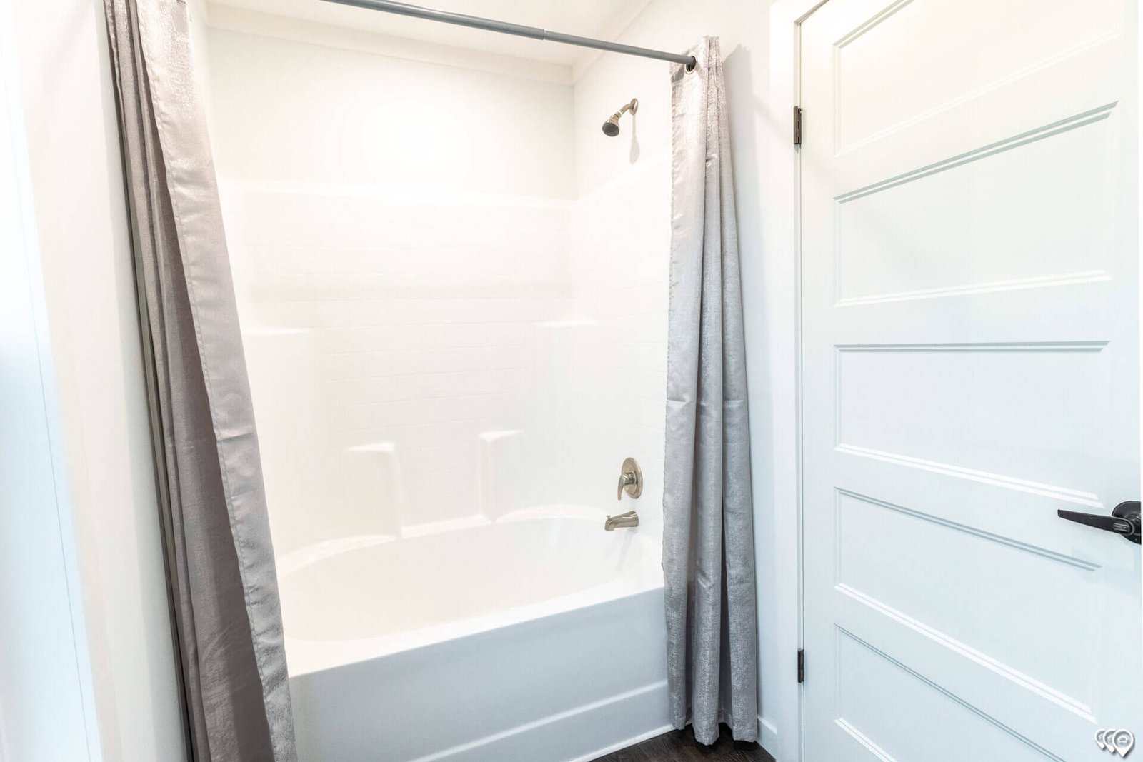 Guest bathroom tub and shower combination in The Trinity CS-3242