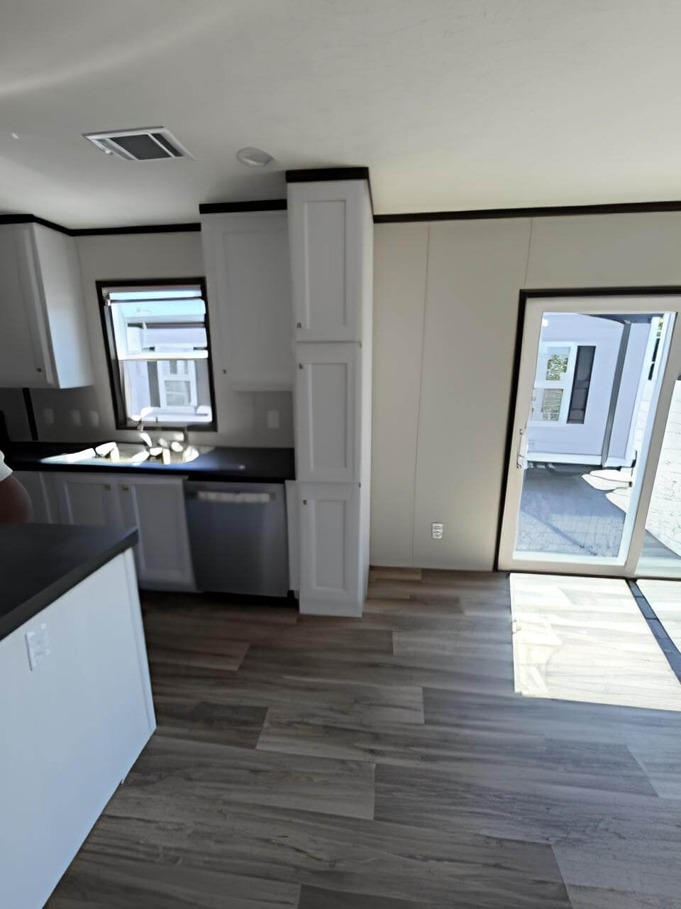 Open-concept kitchen in The Blitz doublewide at New Start Homes