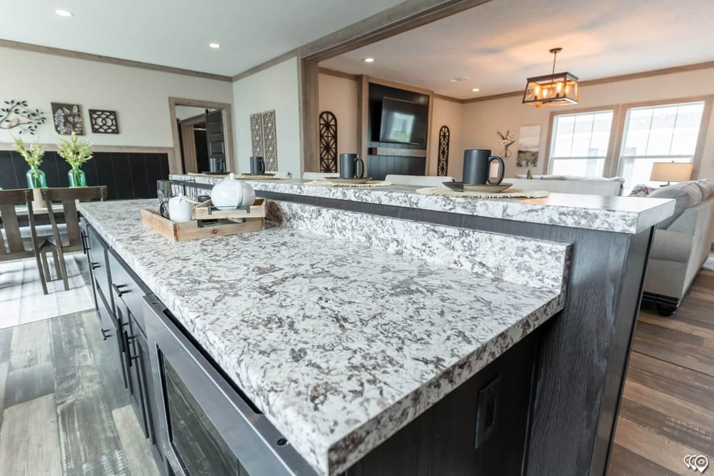 Oversized tiered kitchen island in The Shoal Creek