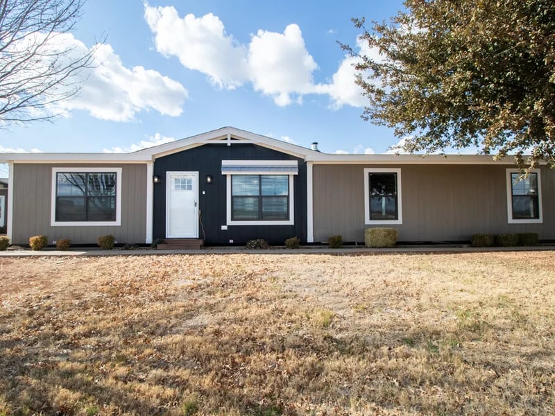 Front exterior of the four-bedroom Clayton NXT Isabella Elite double-wide in Española, NM
