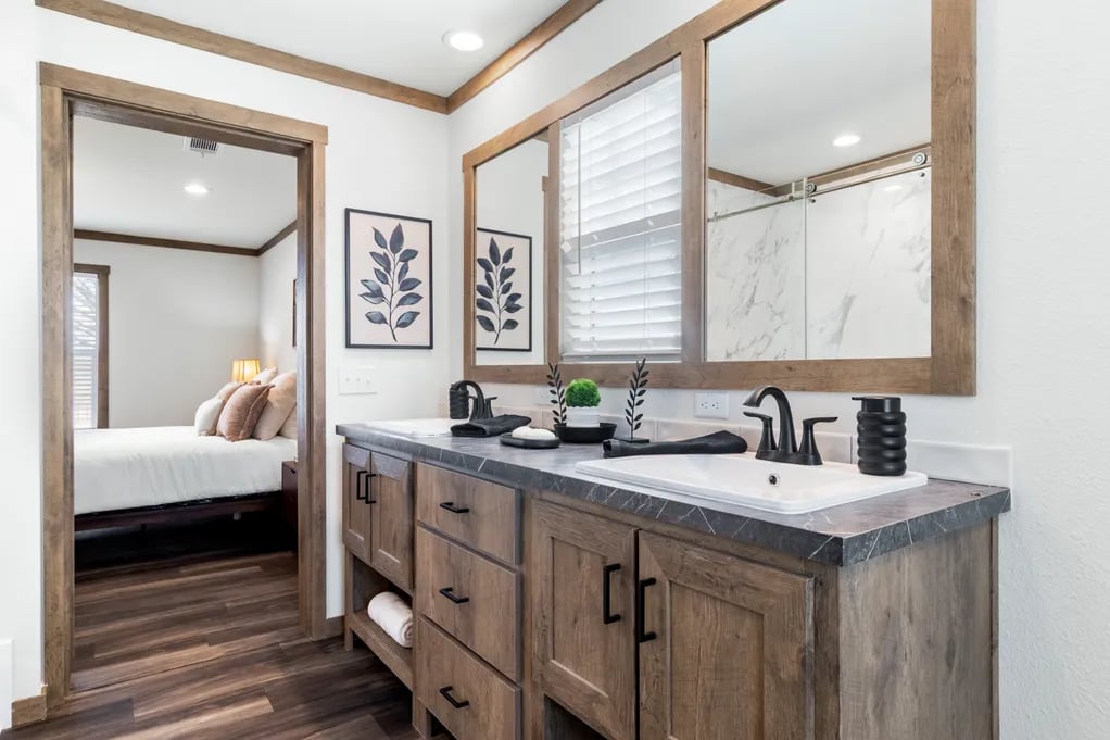 Dual-sink vanity and oversized mirrors in the Isabella Elite primary bathroom