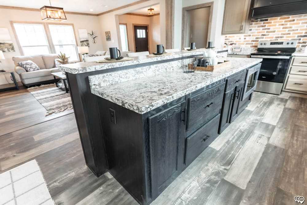Storage-rich kitchen island in this Bastrop County doublewide for sale
