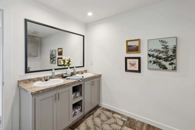 Primary bathroom vanity finishes in the Winter Series 3276H manufactured home