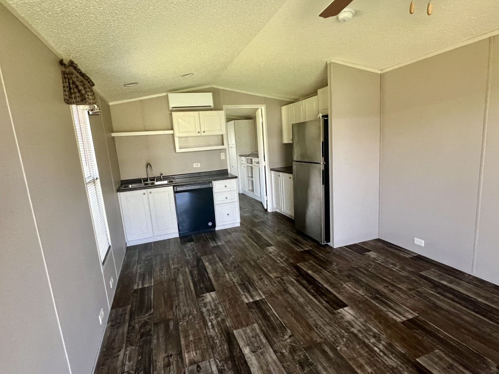 Open kitchen and living area inside The Leah tiny home