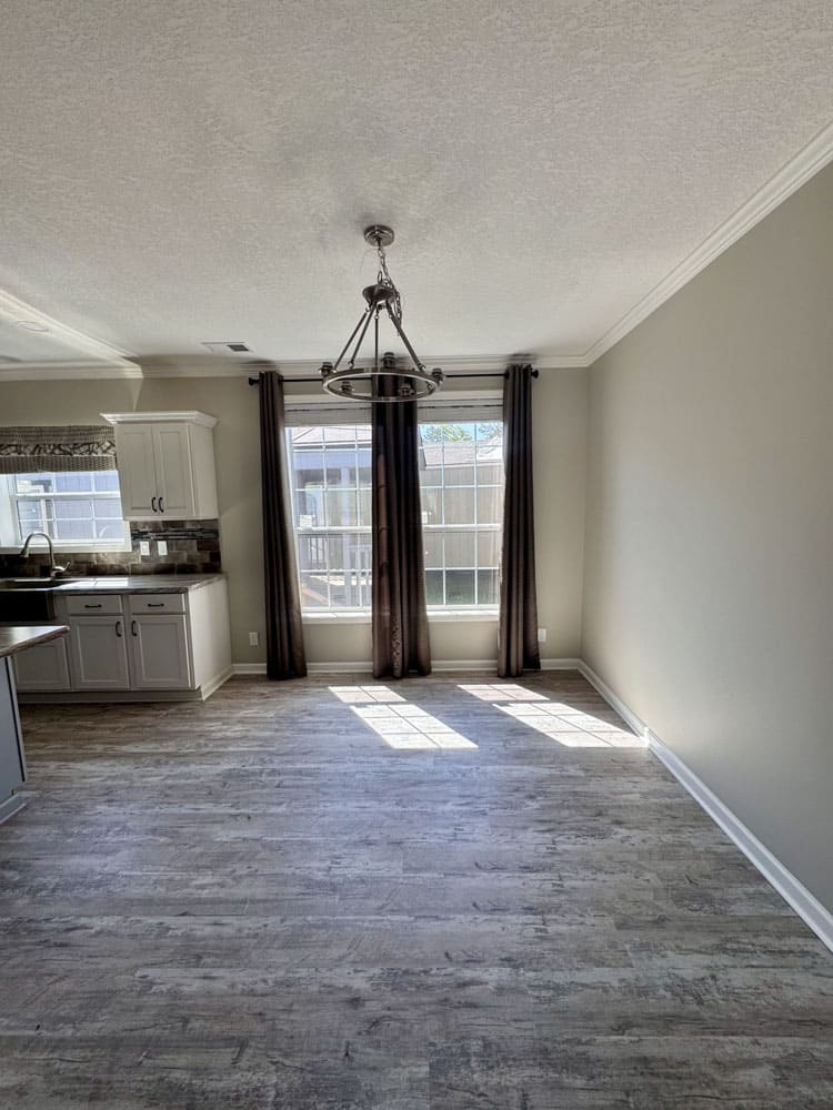 Sunlit dining area in The Ace doublewide home