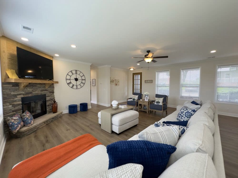 Open living area and fireplace in The Riverwalk home for sale in Bastrop County