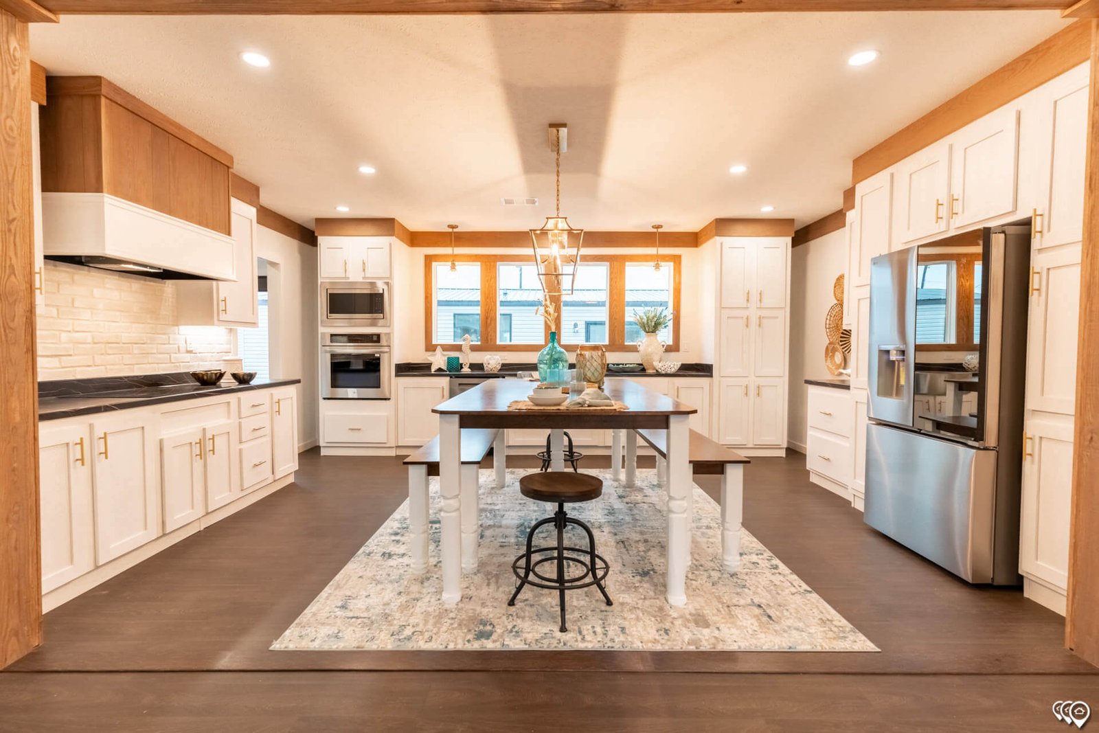 Full-width kitchen with center dining island in The Trinity CS-3242