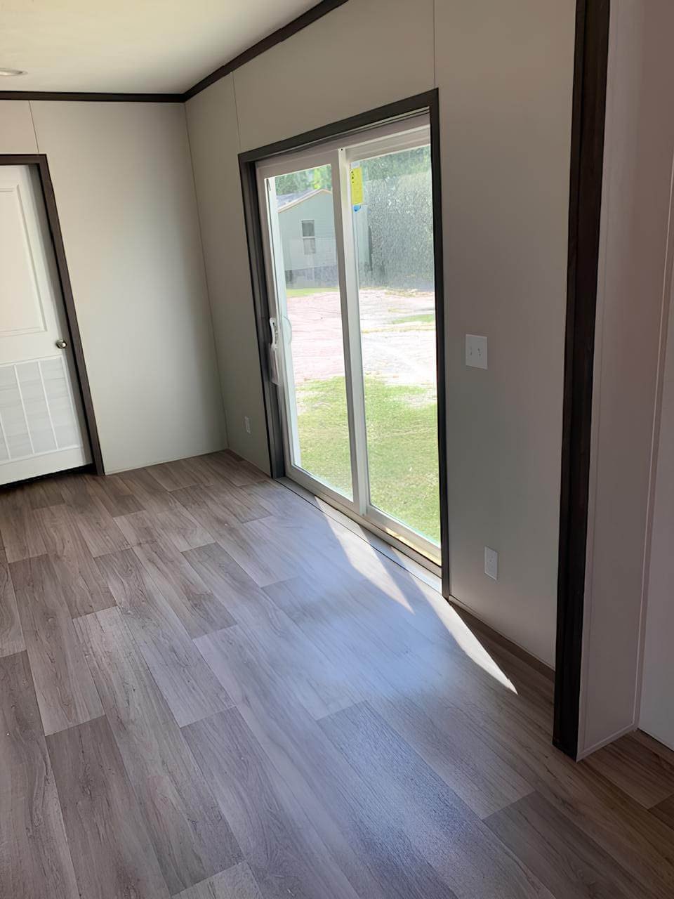 Dining area with sliding glass door in The Colossal Ultrawide