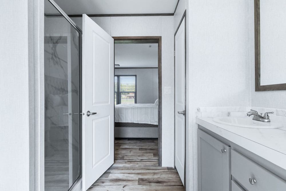 Primary suite entrance with private bath in The Murphy double-wide home