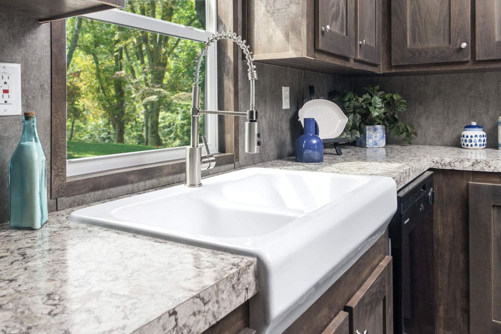 Farmhouse kitchen sink in The Grant single-wide home